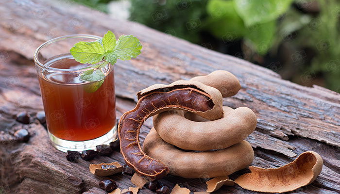 Tamarind juice, Delicious sweet drink tamarind, ripe tamarinds and seeds with mint leaves
